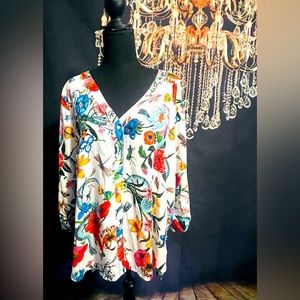 Floral blouse with bow tie on sleeve